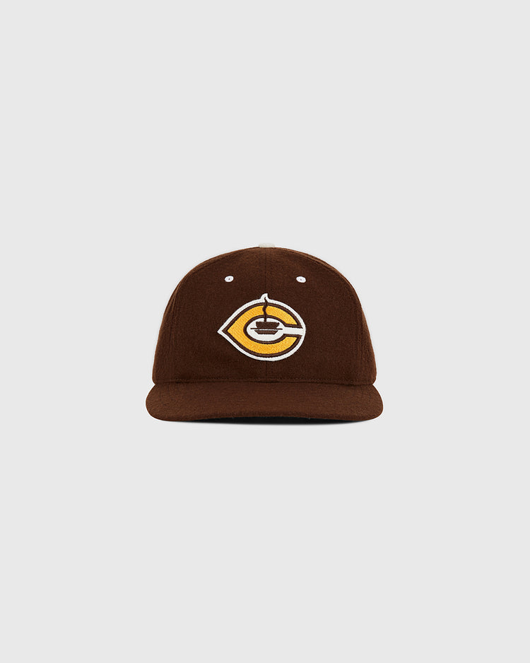 The Cordoba Cafeteros Authentic Wool Ballcap by Ebbets Field is a brown baseball cap featuring a yellow and white embroidered stylized 