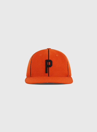 The Ebbets Field Ponce Leones 1951 Authentic Wool Ballcap features an orange design with black vertical lines and a prominent black letter 
