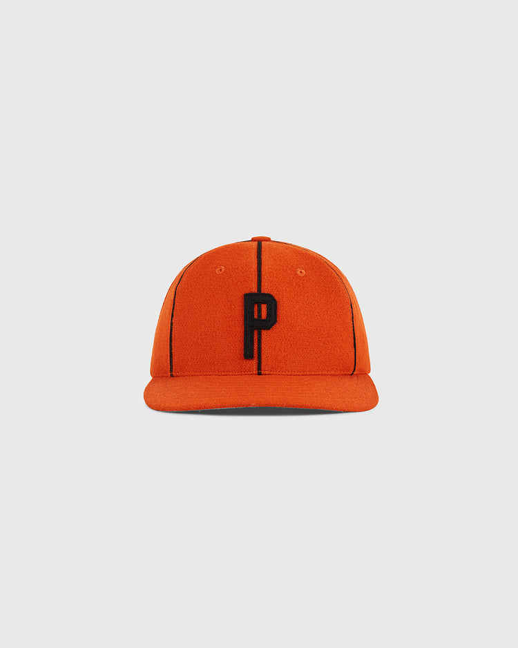 The Ebbets Field Ponce Leones 1951 Authentic Wool Ballcap features an orange design with black vertical lines and a prominent black letter 