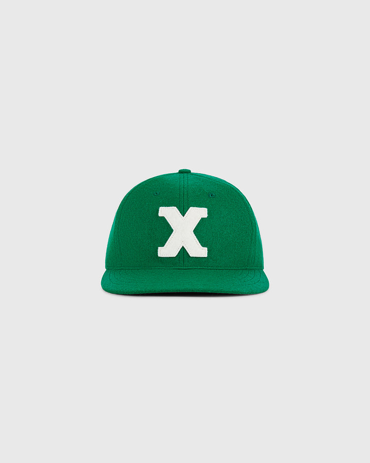 A Xalapa Chileros 1963 Authentic Wool Ballcap by Ebbets Field, featuring a large white letter X on the front, displayed against a plain light gray background.