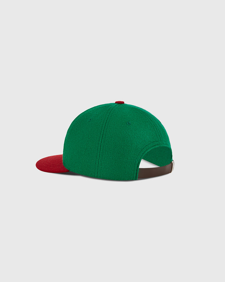 Mexico City Reds 1943 Authentic Wool Ballcap by Ebbets Field, shown from the back. The cap features a green crown with a red bill, a dark adjustable strap, and a button on top—all set against a plain light background.