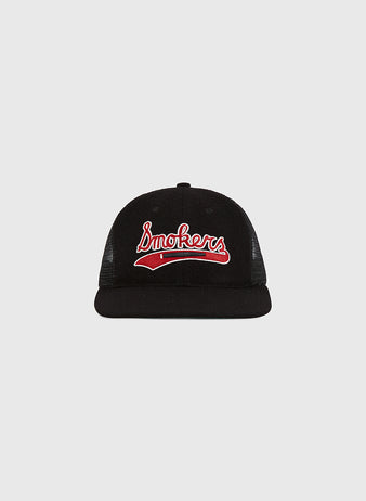 The Tampa Bay Smokers Mesh Trucker Ballcap by Ebbets Field features “Smokers” in red and white script on the front, shown from the front against a light gray background.