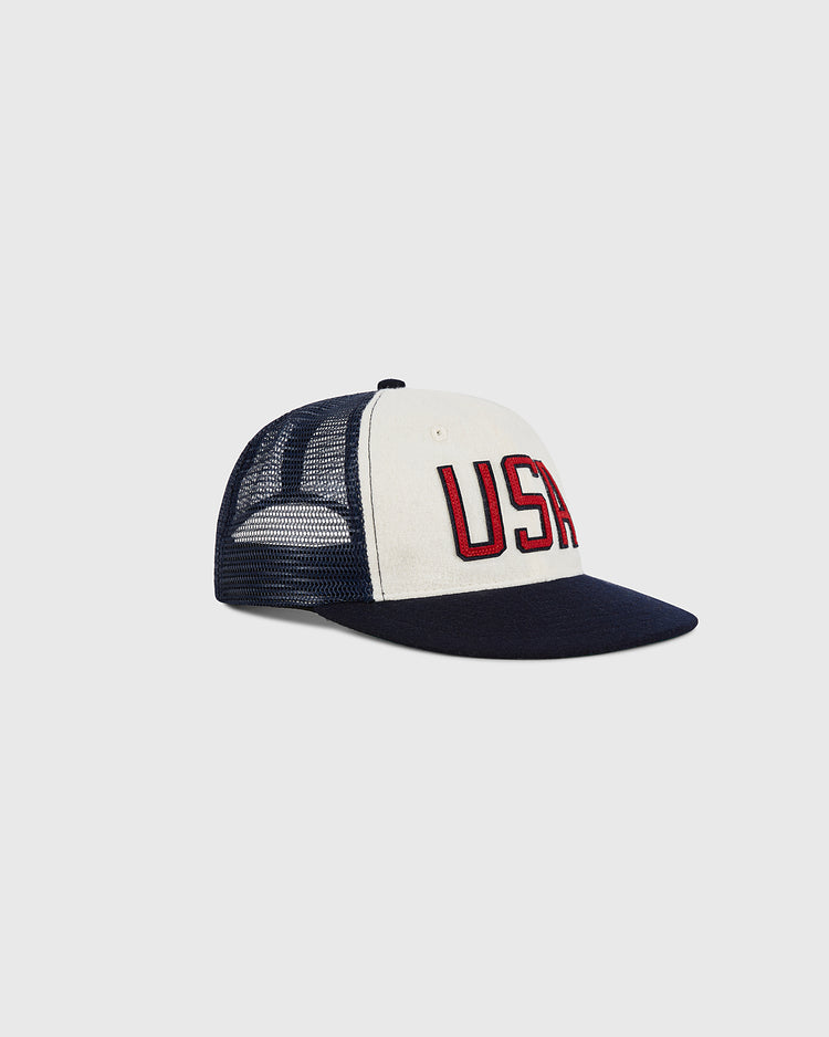 The Ebbets Field USA Wool Mesh Trucker Ballcap features a navy blue and white design with 