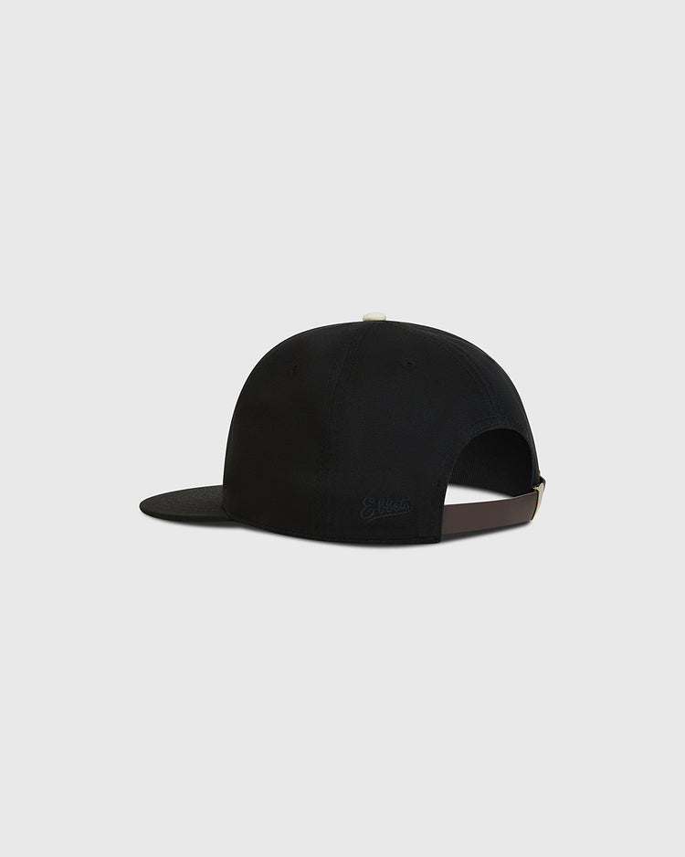The Fuji Athletic Club Cotton Twill Ballcap by Ebbets Field is shown from the back, highlighting its adjustable strap and flat brim. Set against a plain light gray background, this black cap channels classic Japanese American baseball style.