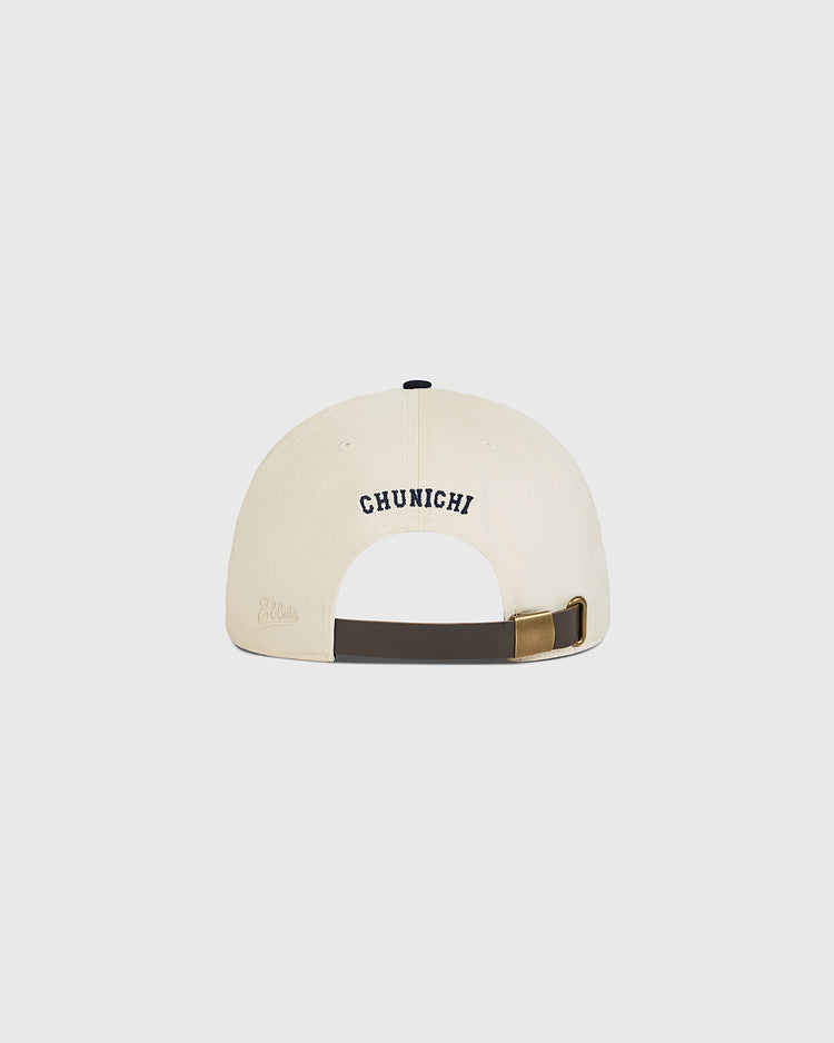 A cream-colored cotton twill ballcap by Ebbets Field, viewed from the back, featuring “CHUNICHI” embroidered in navy blue above the adjustable strap—a classic Chunichi Dragons Cotton Twill Ballcap ideal for celebrating Central League championship glory.