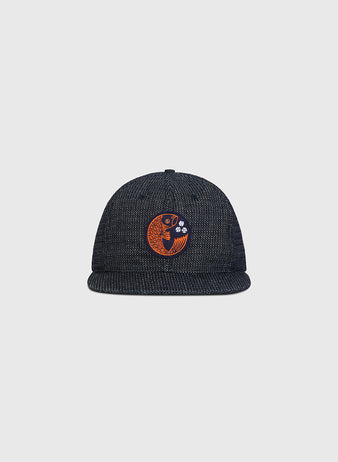 Hiroshima Carp Japanese Indigo Cotton Dobby Ballcap in dark blue with a patterned finish and a circular orange Hiroshima Carp emblem on the front.