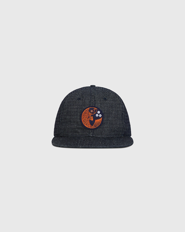 Hiroshima Carp Japanese Indigo Cotton Dobby Ballcap in dark blue with a patterned finish and a circular orange Hiroshima Carp emblem on the front.