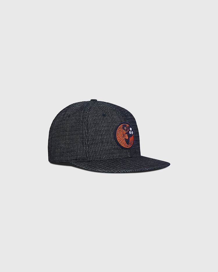 Hiroshima Carp Japanese Indigo Cotton Dobby Ballcap in dark blue with a textured pattern and an embroidered orange Hiroshima Carp emblem on the front.