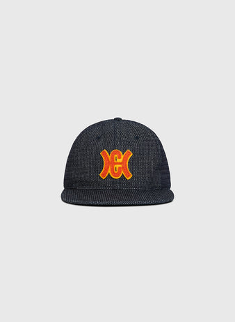 Ebbets Field Hiroshima Carp Japanese Indigo Cotton Dobby Ballcap in dark blue indigo-dyed cotton with a flat brim and an orange and yellow embroidered logo on the front.