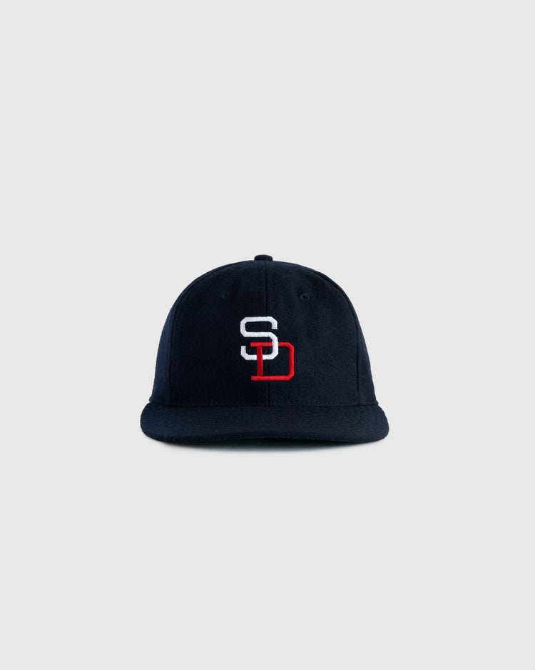 The EFF San Diego Padres (PCL) 1956 Authentic Wool Ballcap features a navy blue design with an interlocking white S and red D SD logo on the front, shown against a plain light gray background.