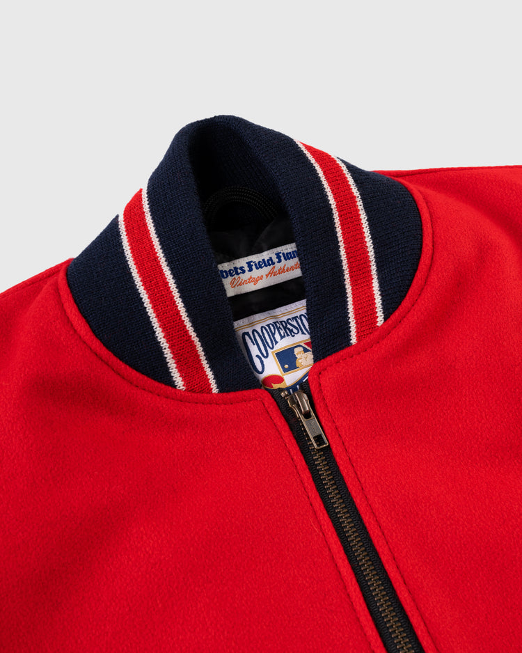 Close-up of the EFF Cincinnati Reds 1940 Authentic Wool & Leather Jacket: red varsity style with black zipper, ribbed navy collar with red and white stripes, and two inner labels, reminiscent of the original 1940 design.
