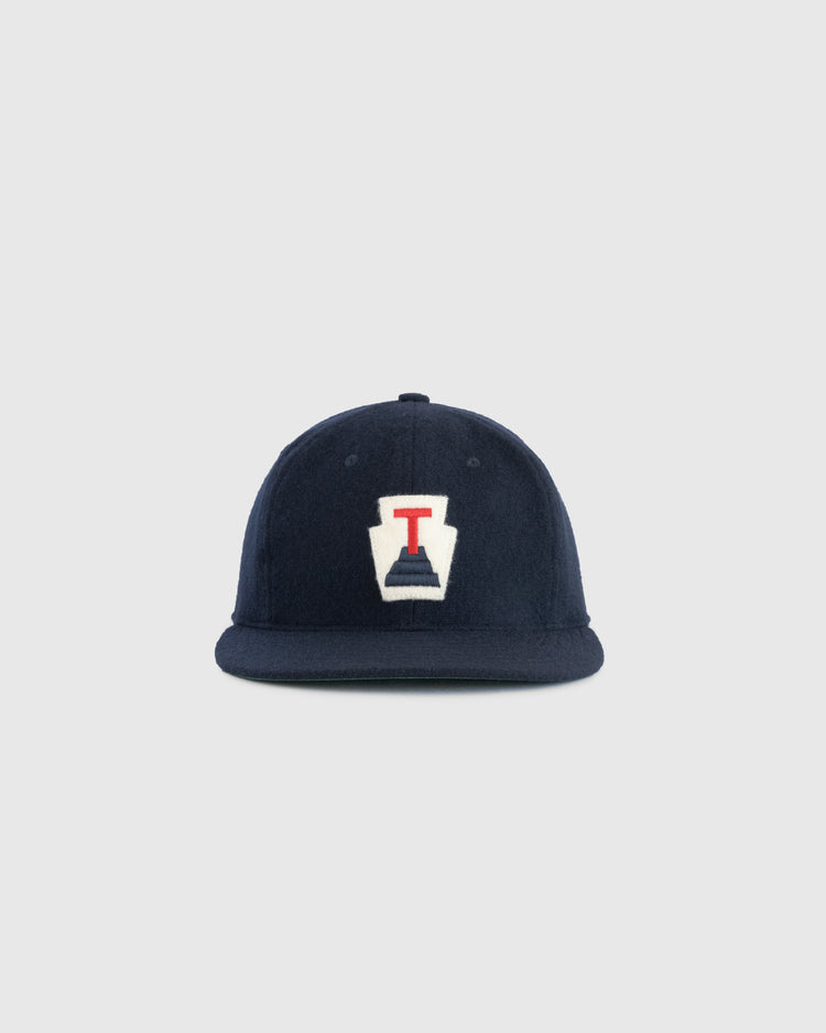 The EFF Tabasco Plataneros 1964 Authentic Wool Ballcap is a navy cap with a white front patch featuring a red “I” and navy design, inspired by the Plataneros de Tabasco, shown on a plain light gray background.