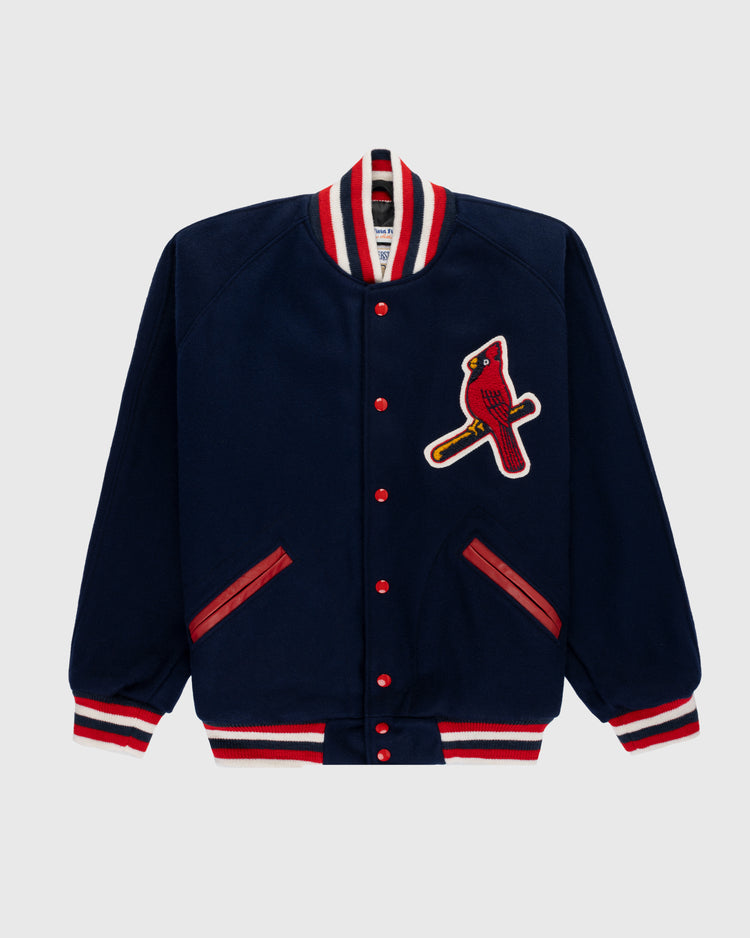 The EFF St. Louis Cardinals 1950 Authentic All Wool Varsity Jacket features a navy design with red and white striped collar, cuffs, and hem, red buttons, red-trimmed pockets, and a bold cardinal patch on the left chest—a true classic replica.