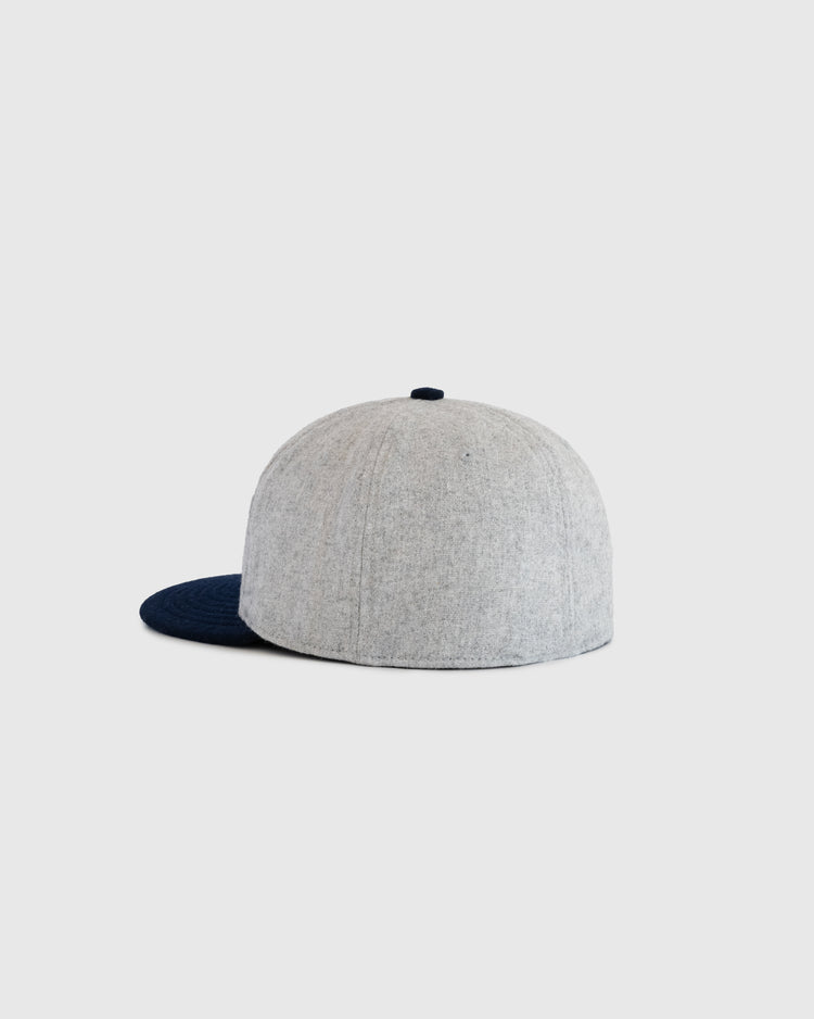 The EFF U.S. Tour of Japan 1922 Authentic Wool Ballcap features a heather gray crown and dark navy brim, shown from the back and side on a plain light background—a must-have for baseball memorabilia collectors.