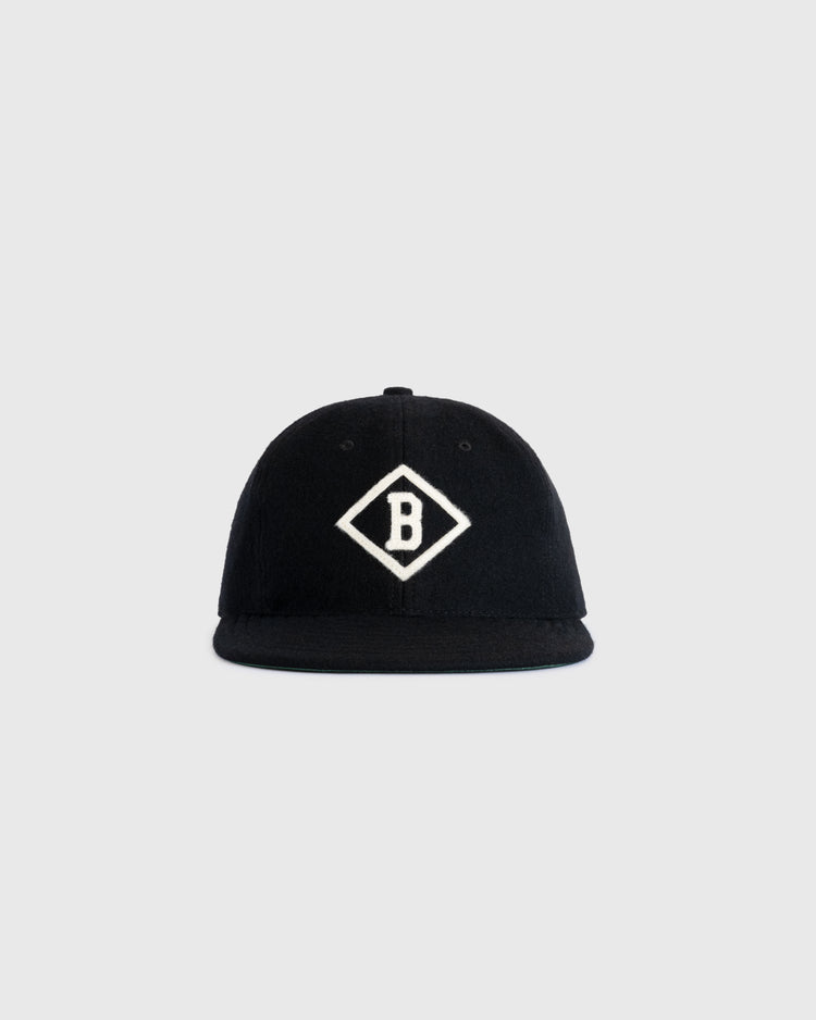 The EFF Bismarck Churchills 1935 Authentic Wool Softbrim Ballcap features a black design with a white diamond B emblem, inspired by the legendary 1935 team, shown against a plain light gray background.