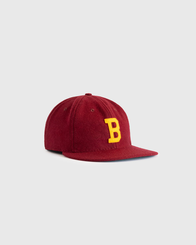 The EFF Brooklyn College 1959 Authentic Wool Ballcap features a maroon design with a felt yellow B on the front, shown on a light gray background.