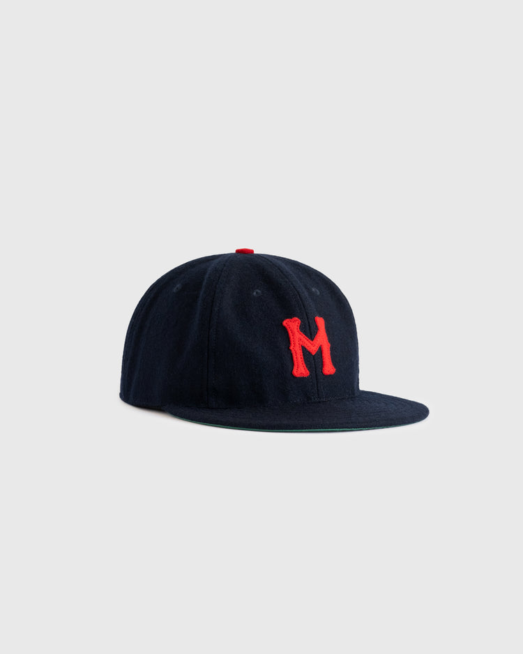 The EFF Minneapolis Millers 1938 Authentic Wool Ballcap features navy wool with a red M on the front, inspired by the classic Ted Williams cap, and is photographed on a plain light gray background.