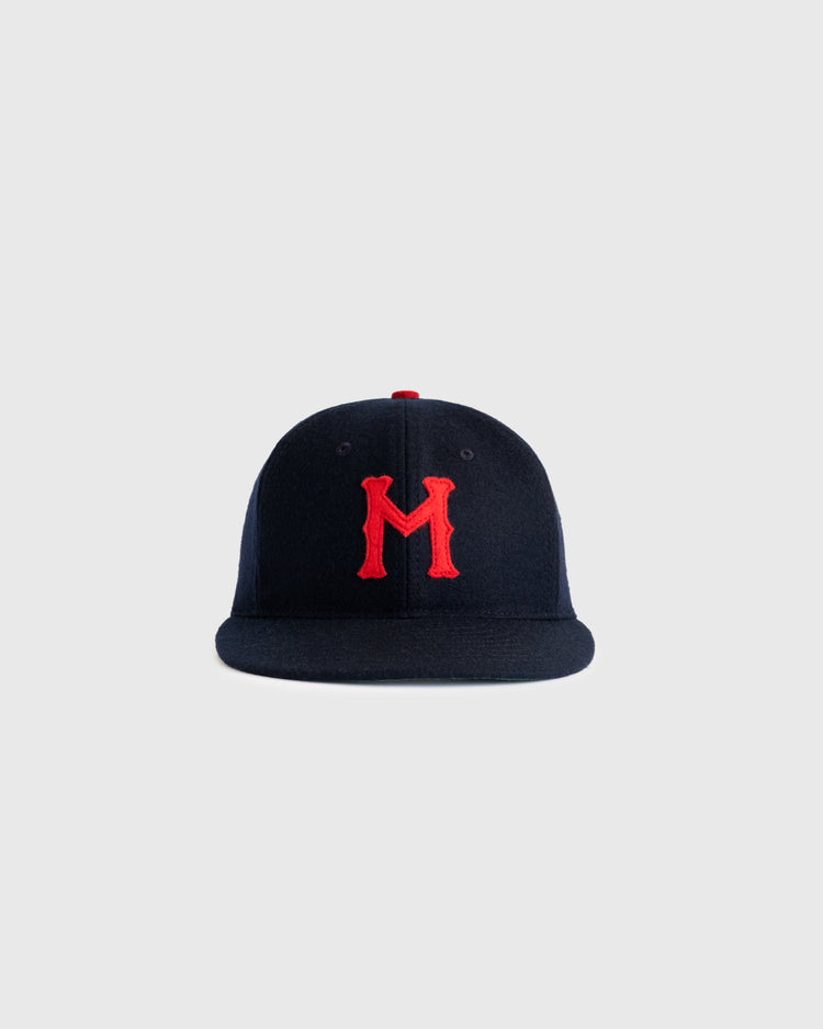 The Minneapolis Millers 1938 Authentic Wool Ballcap by EFF features navy wool with a red M embroidered on the front, inspired by the original 1938 design, displayed on a plain light grey background.