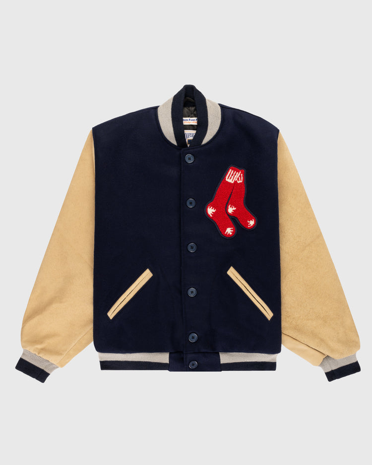 The EFF Boston Red Sox 1938 Authentic Wool & Suede Leather Varsity Jacket features a navy body, beige suede sleeves, front pockets, and a red crossed socks patch on the chest for an authentic baseball look.