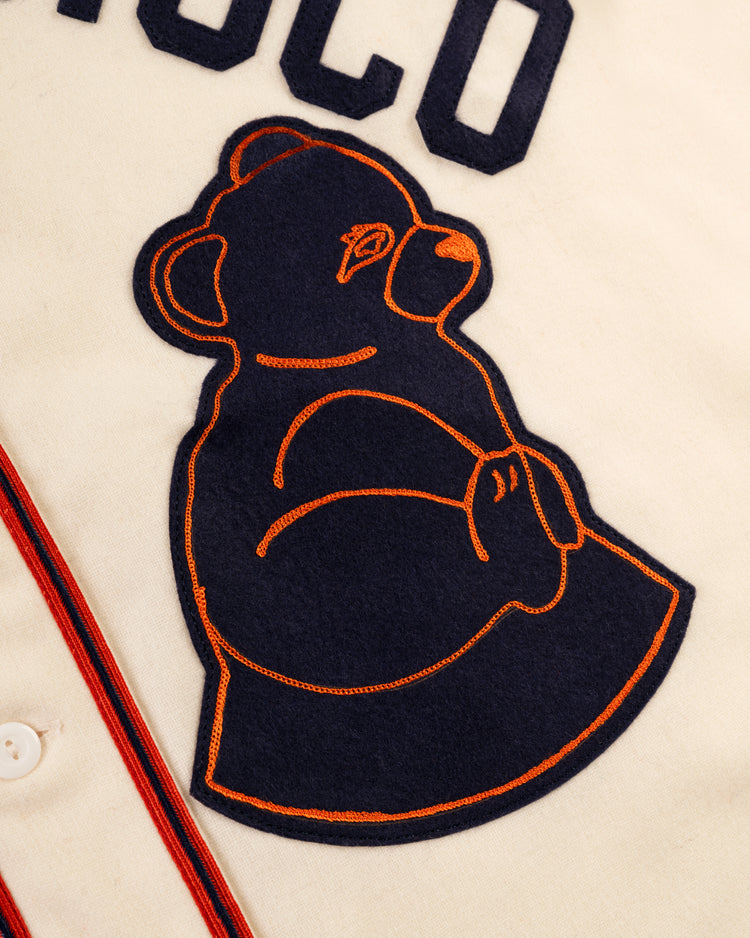The EFF San Francisco Sea Lions 1946 Authentic Wool Home Jersey features a cream color, a large navy bear with orange embroidery, partial block lettering, and red-striped trim, honoring the historic Negro leagues team.
