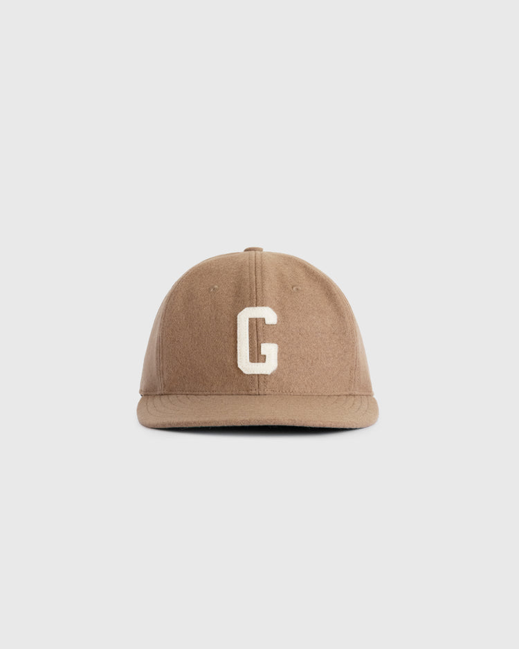 The EFF Homestead Grays G Wool Ballcap is a vintage-style brown cap featuring a white embroidered letter G on the front, inspired by the historic Homestead Grays and shown on a plain white background.