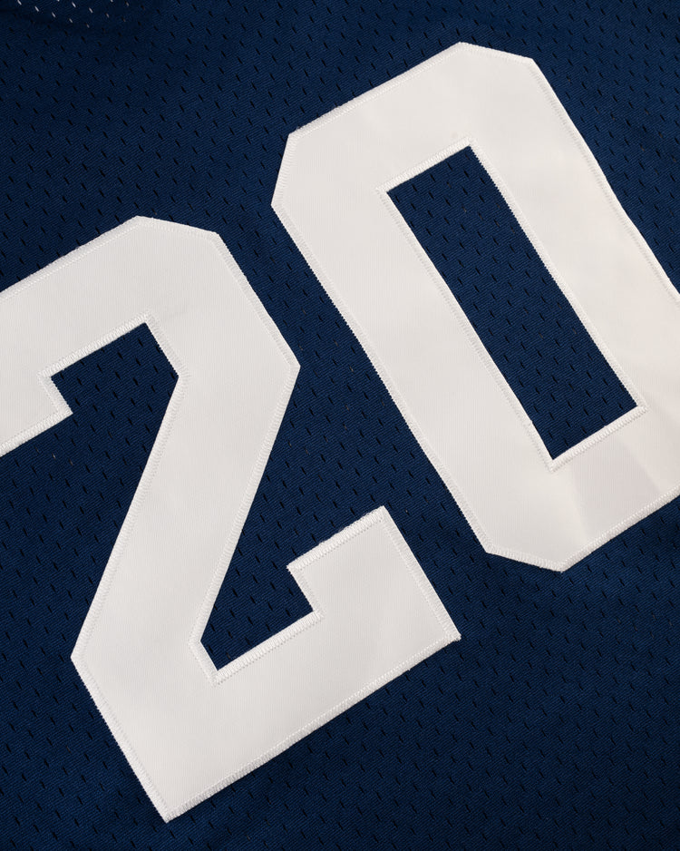 Close-up of a blue EFF Homestead Grays Mesh V-Neck Jersey, featuring the number 20 in large white block letters, paying tribute to baseball history.
