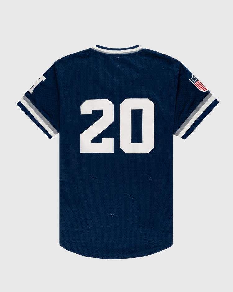 The EFF Homestead Grays Mesh V-Neck Jersey features navy blue mesh, white number 20 on the back, grey and white sleeve stripes, and an American flag patch—honoring Grays baseball history—displayed on a plain light background.
