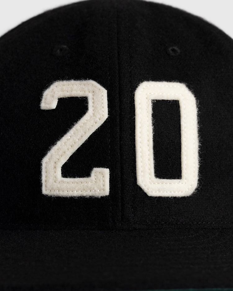 Close-up of the Ebbets Field Flannels Josh Gibson 1945 Signature Series Wool Ballcap—black, vintage-inspired, with large white “20” honoring Josh Gibson and the Negro Baseball Leagues.
