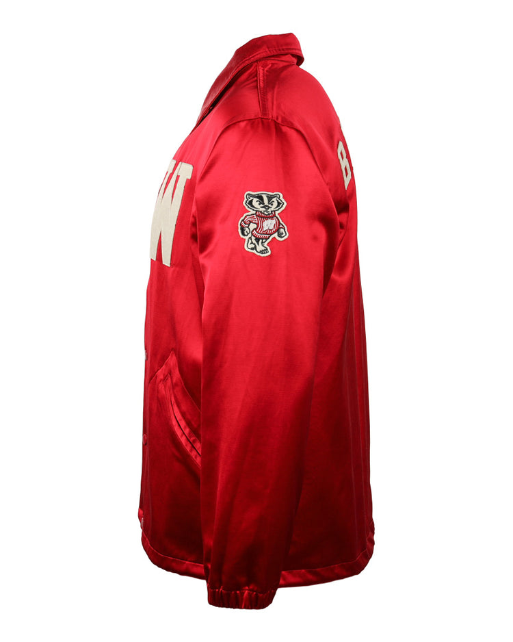 The EFF University of Wisconsin Satin Windbreaker is a bright red jacket with W and B on the front, an embroidered cartoon badger mascot on the sleeve, two front pockets, and a collar, shown from the side.