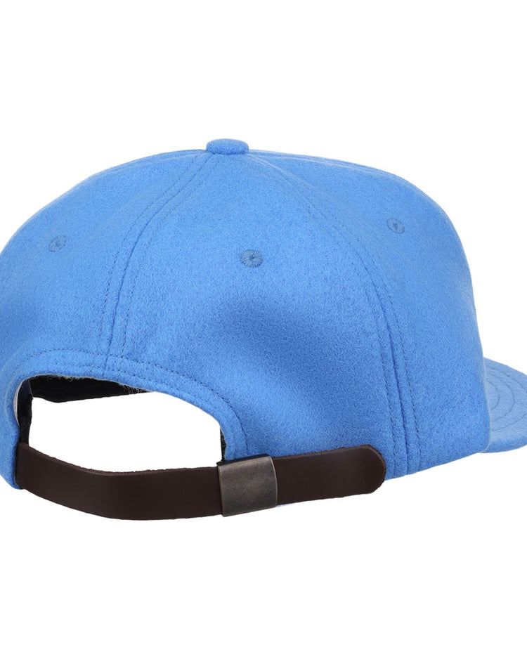The EFF Columbia Blue Wool Vintage Ballcap is shown from the back, featuring a brown adjustable strap with metal clasp. This classic wool ballcap has a rounded crown and visible stitching, and is made in the USA.