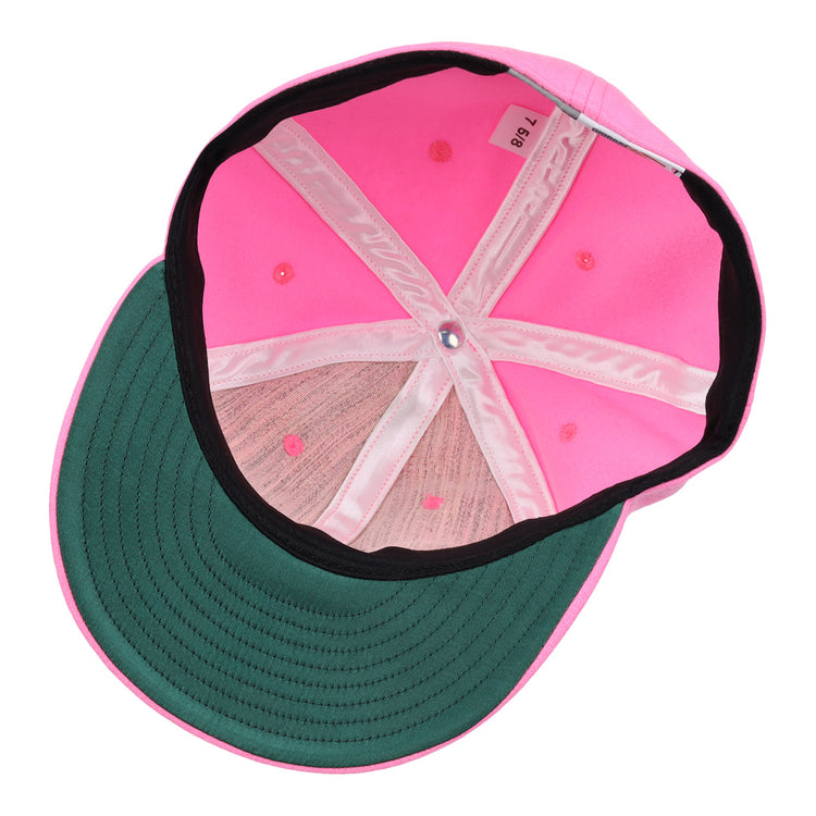Interior view of the EFF Pink Wool Vintage Ballcap featuring a green underbrim, pink stitching, and a size tag marked 7 3/8.