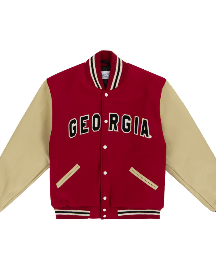 The EFF University of Georgia 1966 Authentic Jacket features a red body, beige sleeves, and striped details. GEORGIA is boldly displayed in black and white across the chest, echoing the iconic 1966 varsity style.