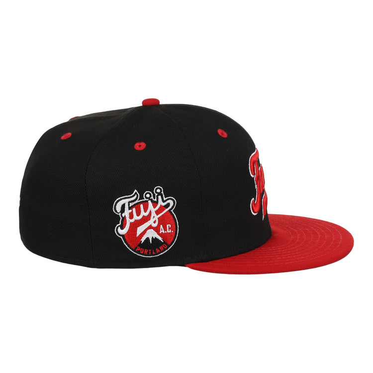 The Fuji Athletic Club EFF DNA Fitted Ballcap by EFF is a vintage-inspired black cap with a red brim, front red and white embroidery, and an embroidered Fujis A.C. Portland patch on the side.