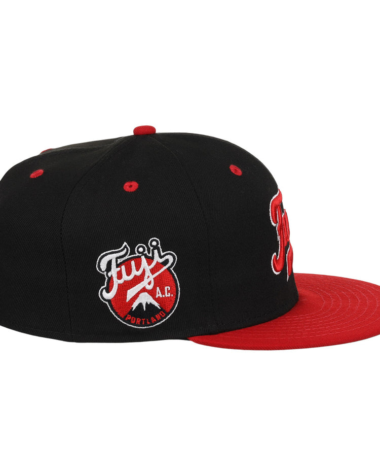 The Fuji Athletic Club EFF DNA Fitted Ballcap by EFF is a vintage-inspired black cap with a red brim, front red and white embroidery, and an embroidered Fujis A.C. Portland patch on the side.