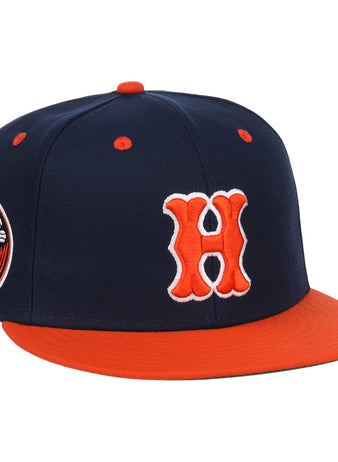 The EFF Hiroshima Carp EFF DNA Fitted Ballcap features navy blue with an orange brim, button, and eyelets, a bold orange and white H on the front in Carp style, and a circular side patch. Inspired by vintage Ebbets Field Flannels.