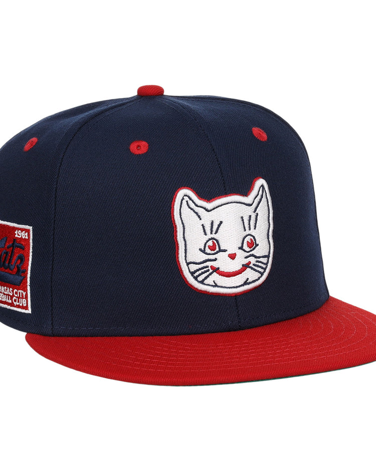 The Kansas City Katz EFF DNA Fitted Ballcap by EFF is a vintage-inspired navy cap with a red brim, Katz embroidered logo, and a 1961, Kansas City Baseball Club patch on the side.