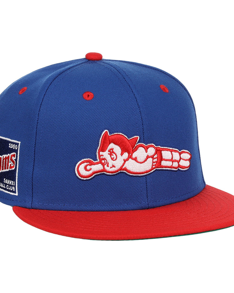 The EFF Sankei Atoms DNA Fitted Ballcap is a blue and red vintage cap with an embroidered Atom Boy flying on the front and a side patch that reads Atoms Baseball Club with the number 4500.