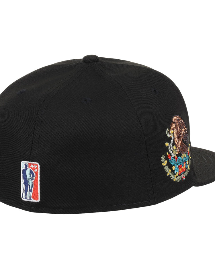 The EFF Veracruz Azules NLB Team Color Fitted Ballcap is black with an embroidered Mexico coat of arms on the side and a small red, white, and blue baseball player logo near the back.