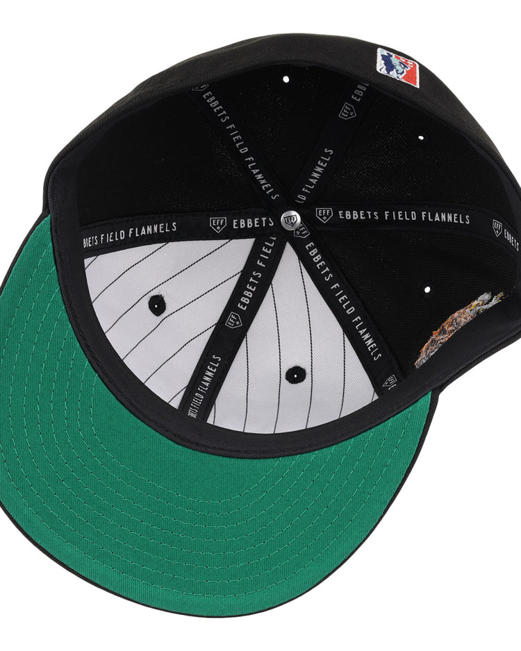 The Veracruz Azules NLB Team Color Fitted Ballcap by EFF has a green underbrim, grey pinstriped lining, branded inner bands, and a sewn patch with a baseball player in the inner crown.