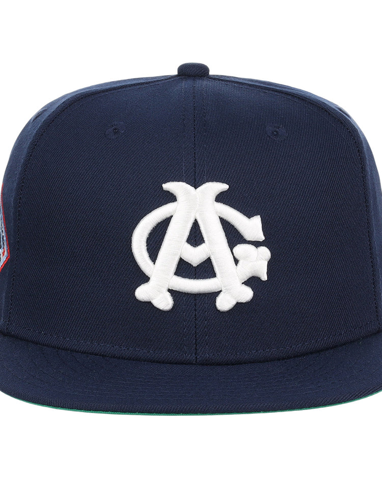 The EFF Chicago American Giants NLB Team Color Fitted Ballcap features a navy crown and visor, white interlocking AC logo on the front, and a left-side patch—perfect for classic baseball style.