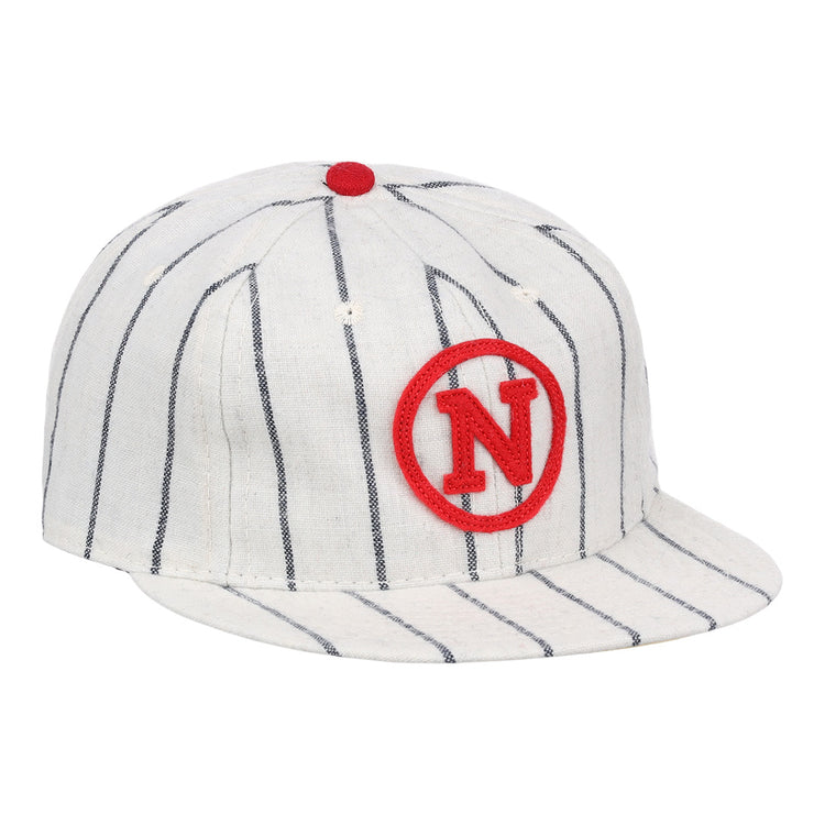 The Limited Edition Newark Peppers 1915 Vintage Ballcap by Ebbets Field Flannels features thin black stripes, a red N inside a red circle on the front, and a small red button—capturing the classic Federal League style.