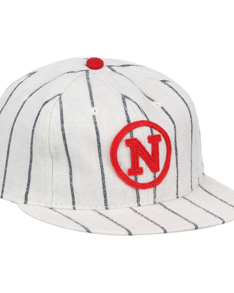 The Limited Edition Newark Peppers 1915 Vintage Ballcap by Ebbets Field Flannels features thin black stripes, a red N inside a red circle on the front, and a small red button—capturing the classic Federal League style.