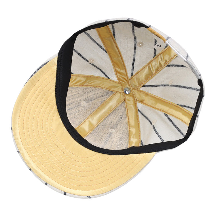 The inside of the Limited Edition Newark Peppers 1915 Vintage Ballcap by Ebbets Field Flannels features yellow stitching, a fabric sweatband, a metal button atop the crown, and a pale yellow brim with visible stitch lines.