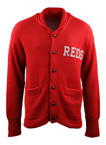 The EFF Cincinnati Reds 1919 Shawl Collar Sweater features a vintage red design with black buttons, two front pockets, and REDS in white letters on the left chest.