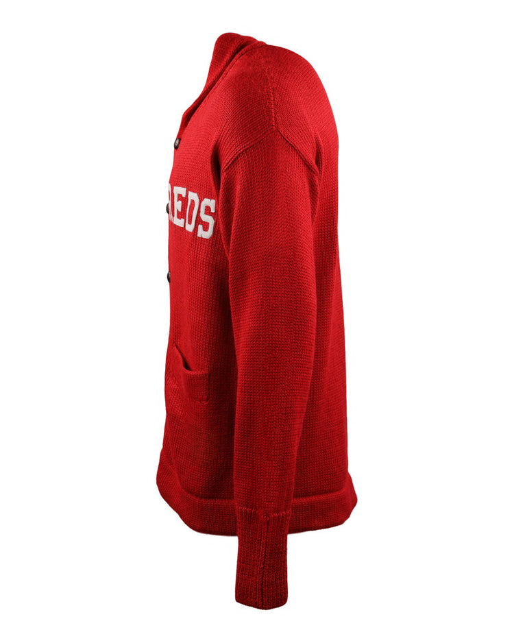 Side view of the EFF Cincinnati Reds 1919 Shawl Collar Sweater, a red button-up cardigan featuring front pockets and partially visible REDS lettering on the chest, inspired by vintage MLB style.