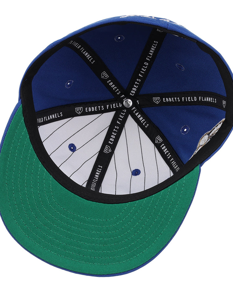 The Jackie Robinson EFF Signature Series Fitted Ballcap - Royal features a green underbrim, white interior panels with black stripes, and black EFF-branded bands—capturing the classic style of vintage Jackie Robinson ballcaps.