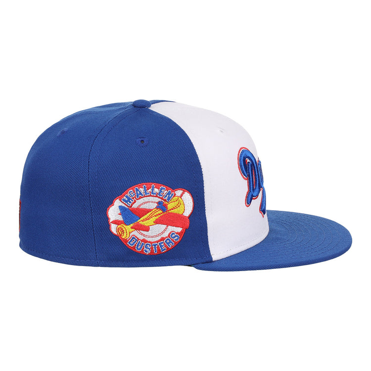 The EFF McAllen Dusters Lone Star Fitted Ballcap features blue and white panels, a flat blue brim, and a colorful yellow airplane patch with HEALEN DUSTERS embroidered, inspired by the classic Lone Star League team.