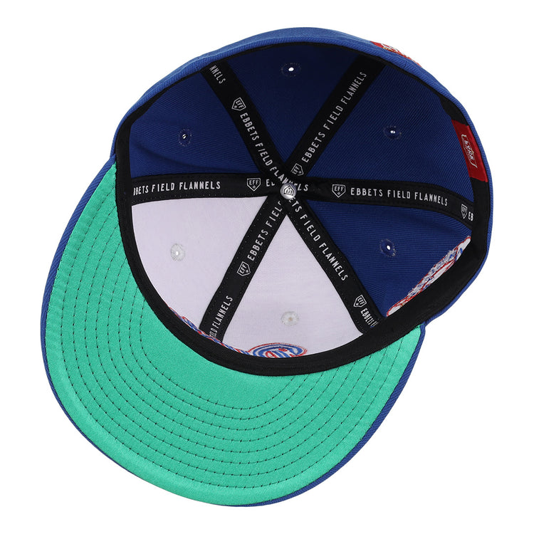 The McAllen Dusters EFF Lone Star Fitted Ballcap by EFF features a green underbrim, blue crown, black and white Ebbets Field Flannels inner piping, silver rivets, and detailed stitching—honoring the Lone Star League’s McAllen Dusters.
