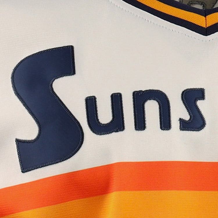 Close-up of the EFF Harlingen Suns Lone Star Baseball Jersey, featuring Suns in bold navy blue on white above orange and yellow stripes—a tribute to Texas baseball pride.