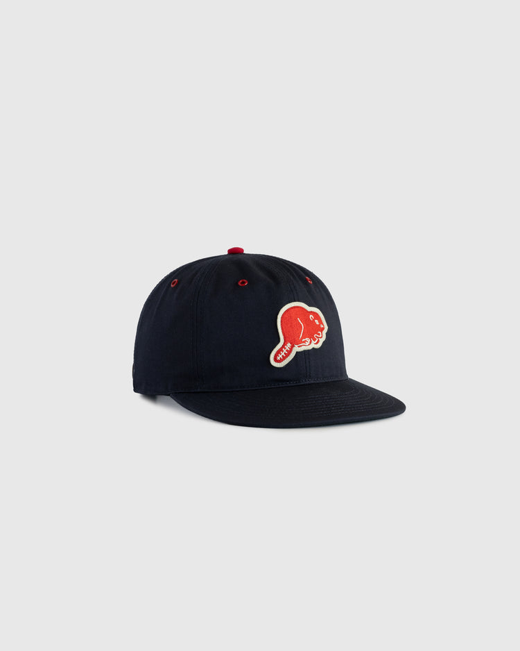 The EFF Portland Beavers Cotton Twill Ballcap is a vintage black cotton hat featuring a red and white embroidered smiling baseball with a red cap on the front, shown against a plain light gray background.